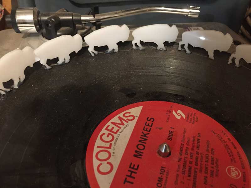 zoetrope record on record player with bison laser cut and mounted around for animation of bison moving Muybridge